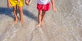 Closeup of little girls legs on tropical beach Royalty Free Stock Photo