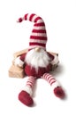 little leprechaun with wool hat sitting on gifts on wh Royalty Free Stock Photo