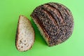 A closeup of a loaf of ancient grain sourdough miche bread