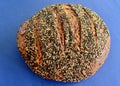 A closeup of a loaf of ancient grain sourdough miche bread