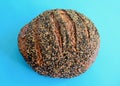 A closeup of a loaf of ancient grain sourdough miche bread