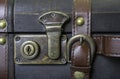 Closeup of lock and leather strap on vintage suitcase, travel co Royalty Free Stock Photo