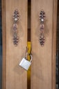 Closeup on locked padlock on wooden door Royalty Free Stock Photo