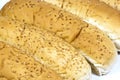 Closeup of Long White Breadrolls Sprinkled with Se