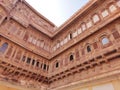 Closeup look of carved structure with multistorey building Royalty Free Stock Photo