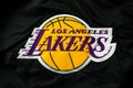 Closeup of Los Angeles Lakers team logo brand on the textile. Los Angeles Lakers team logo of professional basketball club in