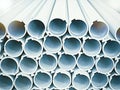 Closeup of a lot of aluminum pipes in a factory