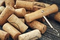 A closeup of a lot of wine bottle corks and a corkscrew Royalty Free Stock Photo