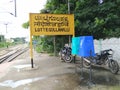 Closeup of Lottegollahalli Railway Station with Yellow and black Color Name Board