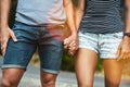 Closeup, love or couple holding hands on date with support, respect or care for romance on road. Walking, bokeh zoom or