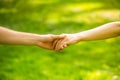 Closeup of loving couples holding hands while walking. Couple holding hands in the park. Hands, couples. Couple hold Royalty Free Stock Photo