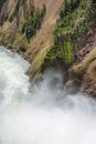 Closeup of Lower falls Yellowstone river. Raging waters. Spray from waterfall.