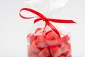 Closeup of luxury bag of candy strawberries with red ribbon Royalty Free Stock Photo