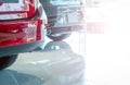 Closeup luxury SUV car with sport design parked in modern showroom. Rear view of red shiny SUV car in showroom. Car dealership Royalty Free Stock Photo