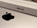 Closeup of a Macbook with an Apple pencil in a box