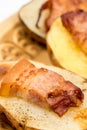 Closeup macro baked potatoes with fried bacon