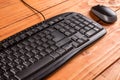 Closeup macro black pc keyboard with black wireless mouse Royalty Free Stock Photo