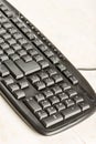 Closeup macro black pc keyboard with black wireless mouse Royalty Free Stock Photo
