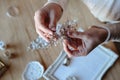 Closeup macro photo of details, workplace of decorator and creator of wedding imitation jewelry.