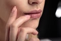 Closeup macro photo of woman`s lips with natural lip balm Royalty Free Stock Photo