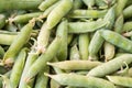 Closeup macro pile of fresh green peas ready for cleaning