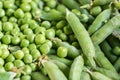 Closeup macro pile of fresh green peas ready for cleaning