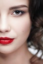 Closeup macro portrait of female face. Human woman half-face  with day beauty makeup Royalty Free Stock Photo