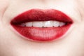 Closeup macro portrait of female red smiling lips with day beauty makeup Royalty Free Stock Photo