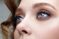 Closeup macro shot of blue human female eyes. Woman with natural face beauty makeup Royalty Free Stock Photo