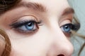 Closeup macro shot of blue human female eyes. Woman with natural face beauty makeup Royalty Free Stock Photo