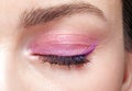 Closeup macro shot of closed human female eye. Woman with perfect skin and pink eyes shadows Royalty Free Stock Photo