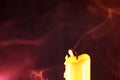 Closeup macro shot of an extinguished candle in a dark environment Royalty Free Stock Photo