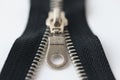 Closeup macro shot of open black brass zipper isolated on white background Royalty Free Stock Photo