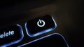 Closeup macro shot power button with blue led backlight on notebook keyboard for metaverse technology concept backgroud Royalty Free Stock Photo