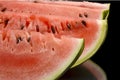 Closeup macro shot of slices of watermelon on black