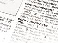 Closeup of the dictionary definition of the word communicate Royalty Free Stock Photo