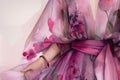 A closeup of a magenta dress with bell sleeves and a tulle skirt. Trendy color of 2023 Viva Magenta.. AI generation