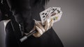 Magic wand and cards in hands of female magician. Closeup Royalty Free Stock Photo