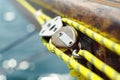 Closeup of mainsheet on old vintage wooden yacht with yellow rope Royalty Free Stock Photo