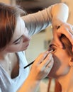 Closeup of a makeup artist applying makeup Royalty Free Stock Photo