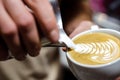 Closeup of making latte art with milk in espresso cup Royalty Free Stock Photo