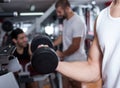 Closeup of male arm with dumbbells Royalty Free Stock Photo