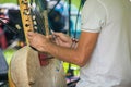 Closeup of male artist holding kora lute