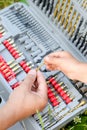 Closeup of male and child's hands with screwdriver