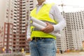 Closeup of male engineer holding blueprints and documents Royalty Free Stock Photo