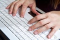 Closeup male fingers on the laptop