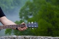 Closeup of male guitarist hand playing guitar Royalty Free Stock Photo