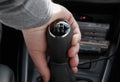 Closeup of male hand on gearshift stick