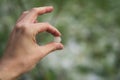 Closeup male hand holding hailstones after hailstorm Royalty Free Stock Photo