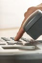 Closeup of a male hand making a phone call by dialing a classica Royalty Free Stock Photo